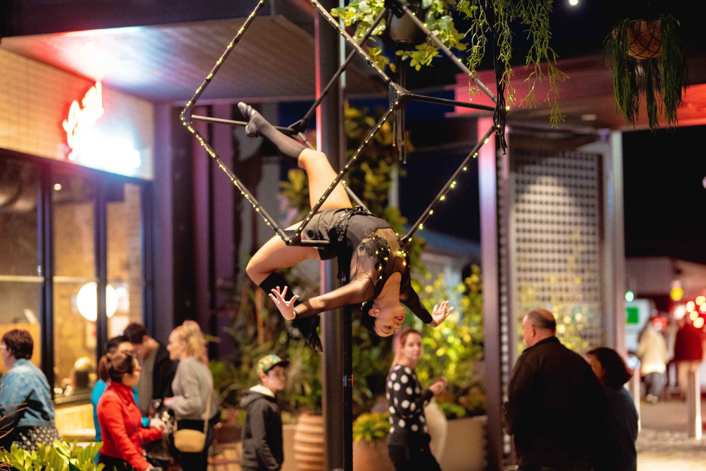 An aerialist performs inside the frame of a large prism, which stand 3.5 metres in the air. 